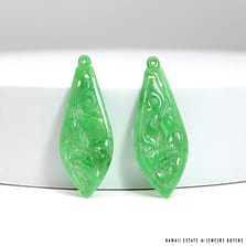 4.9g PAIR OF CARVED AND PIERCED GREEN JADE MEASURES 47.3x18mm