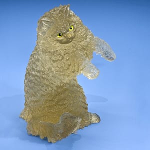GIA: "This golden cat is carved in citrine from Brazil. Its eyes are made of peridot and gold. - Robert Weldon"