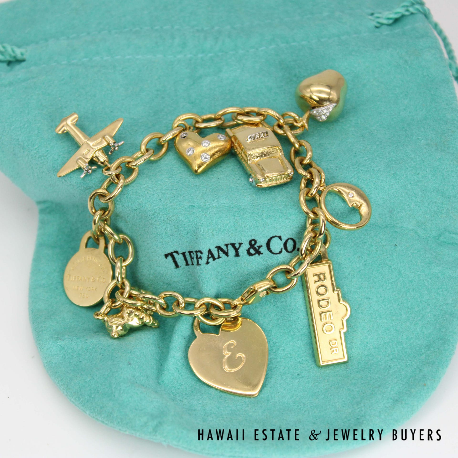Tiffany & Co. Nine Charm Bracelet 18k Yellow Gold Size 6.75 with